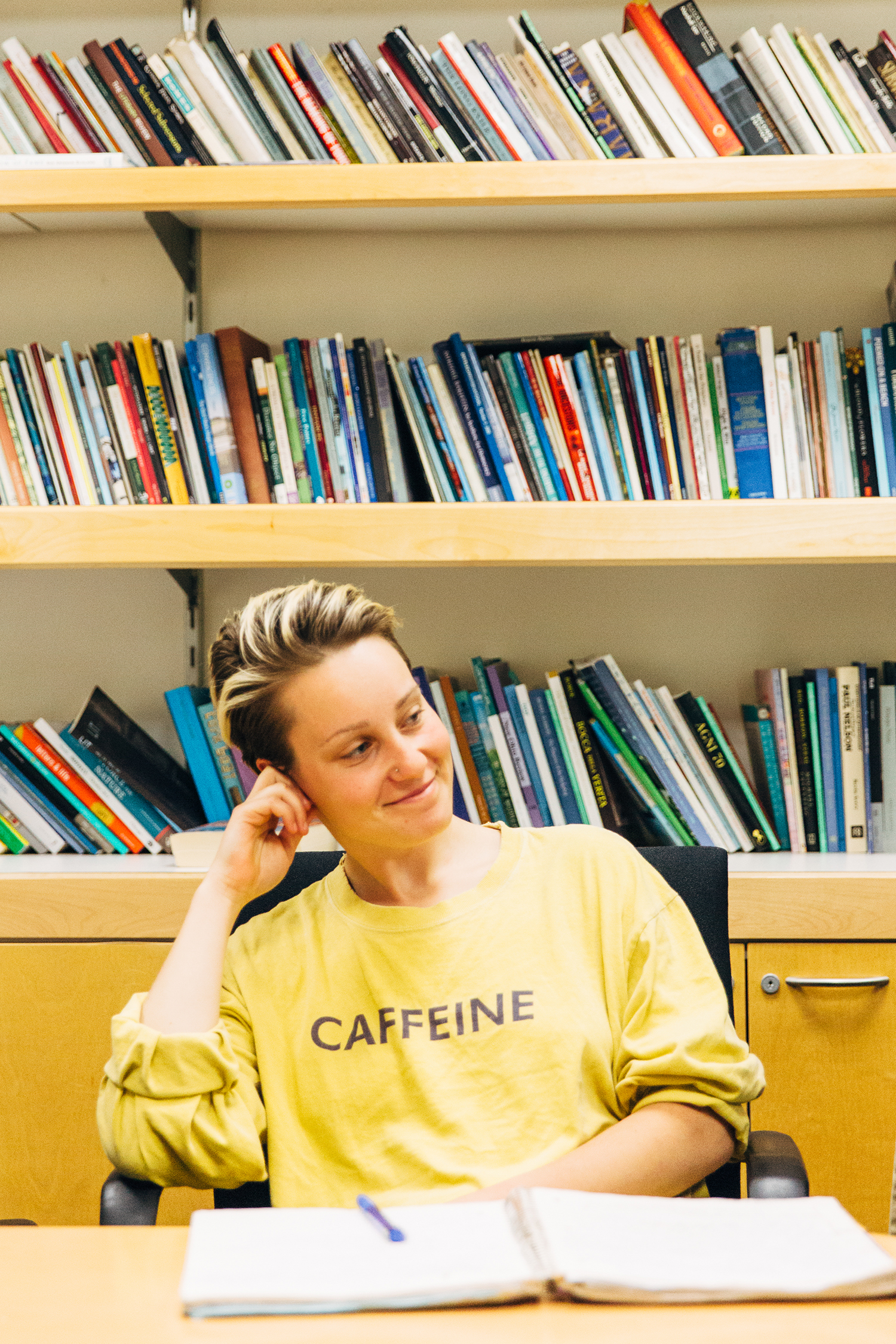 Student with Bookshelf